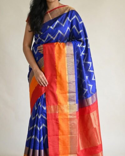Home blue ikat pattu silk saree with red & orange contrast border
